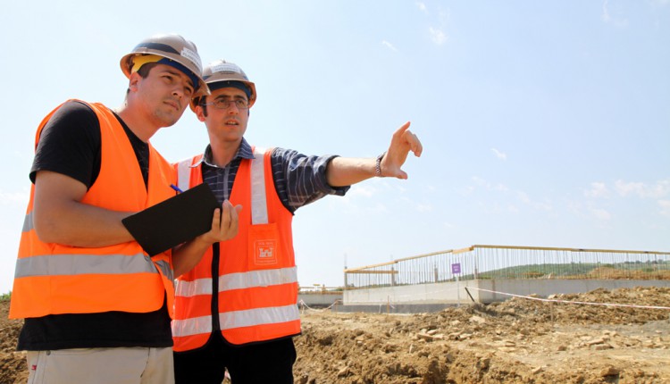Two contractors ensuring the site meets the builders best practice